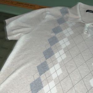 Men’s Claiborne argyle knit pullover with buttons and collar.